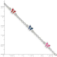 Silver chain bracelet with three colorful enamel butterfly charms in red, blue, and pink, displayed against a measurement scale.