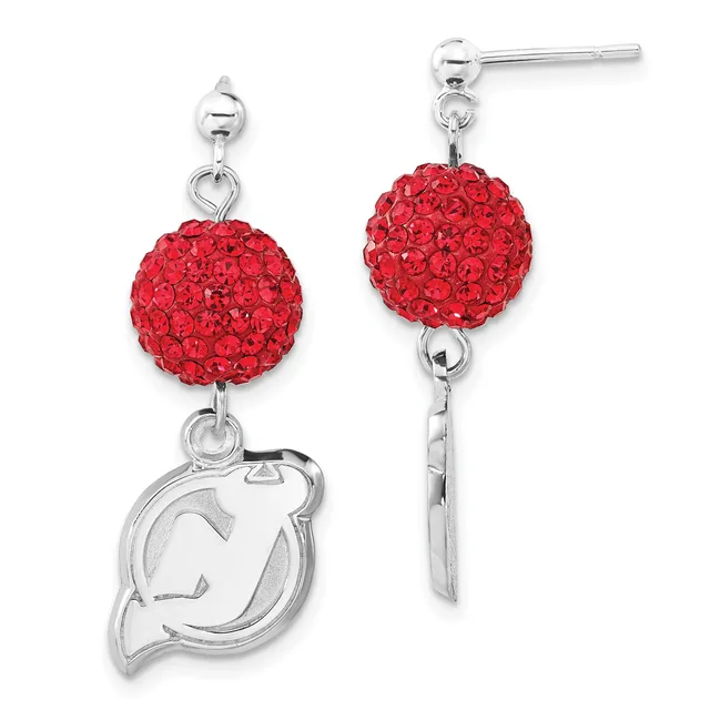 Pair of silver dangle earrings with red crystal-studded spheres and a silver charm shaped like a stylized horse head or profile.