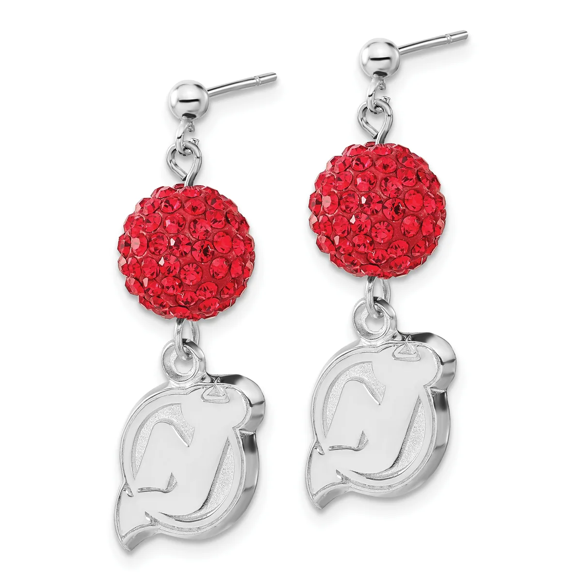 A pair of silver drop earrings with red crystal-encrusted spheres suspended above engraved silver charms shaped like stylized faces.