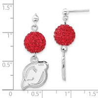 Pair of silver earrings with red crystal ball drops and small silver charm pendants, displayed against a measurement ruler showing approximately 1.25 inches in length.