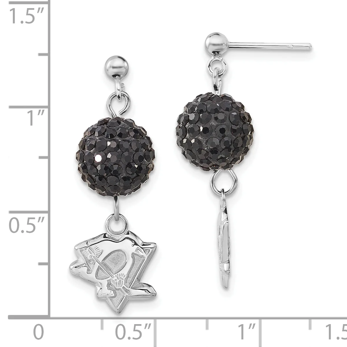 A pair of silver dangle earrings with black crystal ball tops and mismatched bottoms: one featuring a star-shaped charm and the other a plain silver bar, shown against a measurement scale.