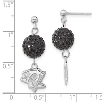 A pair of silver dangle earrings with black crystal ball tops and mismatched bottoms: one featuring a star-shaped charm and the other a plain silver bar, shown against a measurement scale.