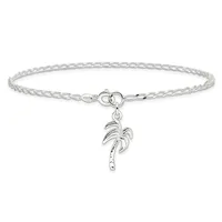 Silver-toned chain bracelet with a circular clasp and a dangling palm tree charm featuring decorative dots along the trunk.