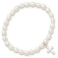 A stretchy bracelet made of round white pearl beads with a small silver-toned cross charm attached.