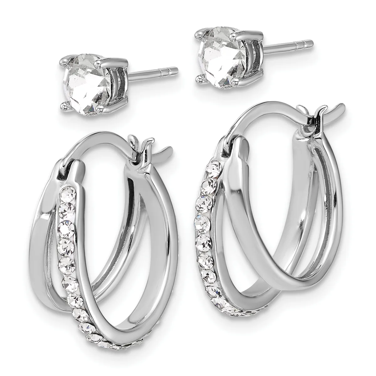 Two pairs of silver stud and hoop earrings: studs feature round clear faceted stones in four-prong settings; hoops have a polished silver finish with pavé-set clear crystals along one side.