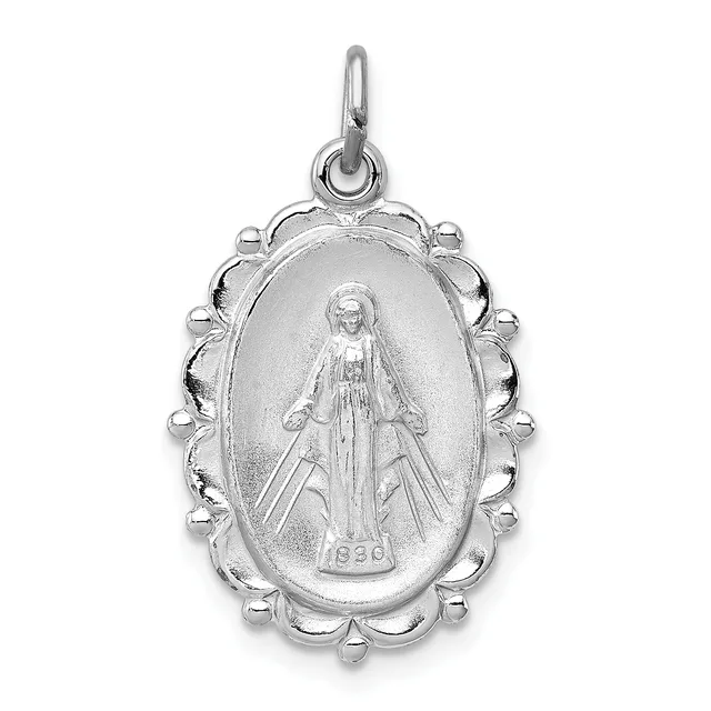Silver oval religious medal pendant with scalloped decorative border, featuring a standing female figure in robes with a small stamped hallmark at the base.