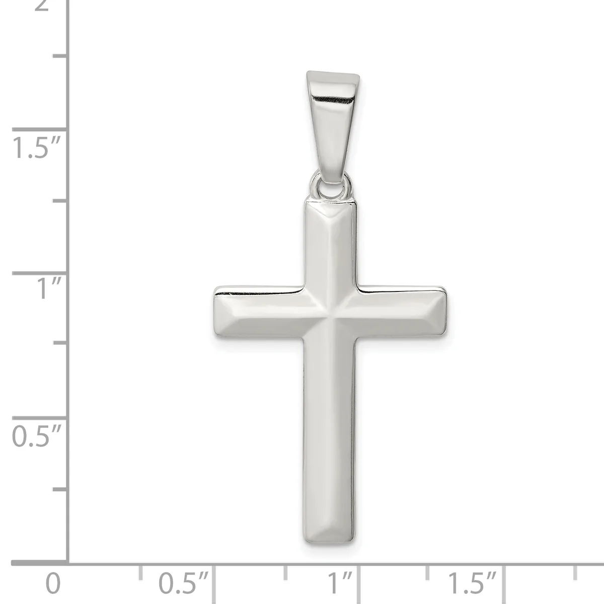A polished silver cross pendant with rounded edges and a bail at the top, shown against a measurement scale indicating approximately 1.5 inches in height.