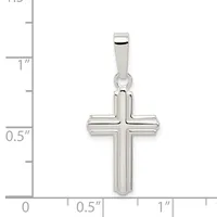 A polished silver cross pendant with a rectangular bail, shown next to a ruler indicating it measures approximately one inch tall and half an inch wide.