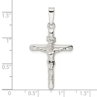 Sterling silver crucifix pendant with detailed corpus figure, shown against a ruler measuring approximately 1.5 inches in height.
