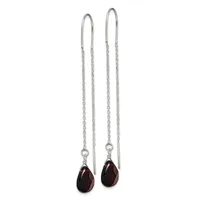 Pair of silver threader earrings with delicate chain strands and dark faceted teardrop gemstones hanging from curved ear wires.