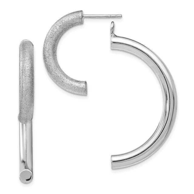 Two silver hoop earrings displayed against a white background: one with a textured frosted finish and one with a polished smooth finish.