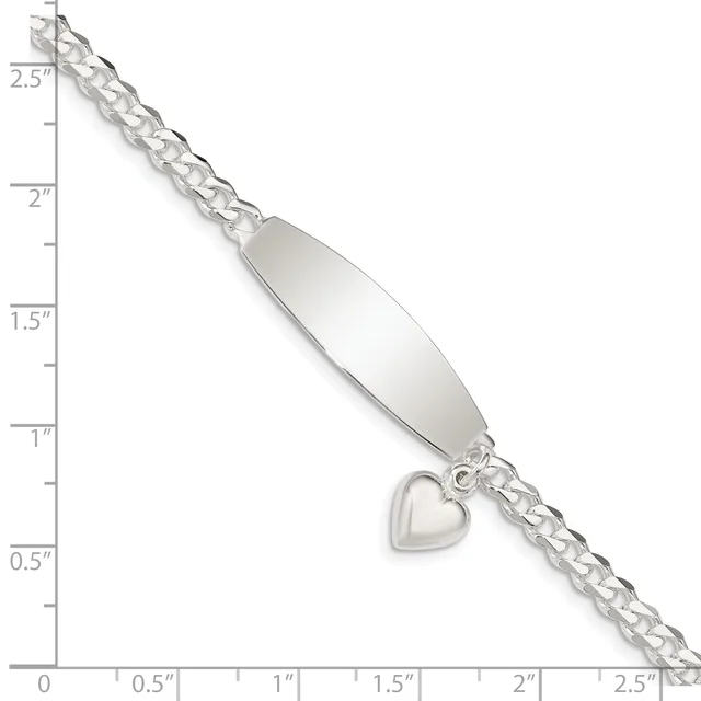 Silver bracelet with an oval nameplate and small heart charm hanging from curb chain, displayed against a ruler showing approximately 2.5 inches in length.