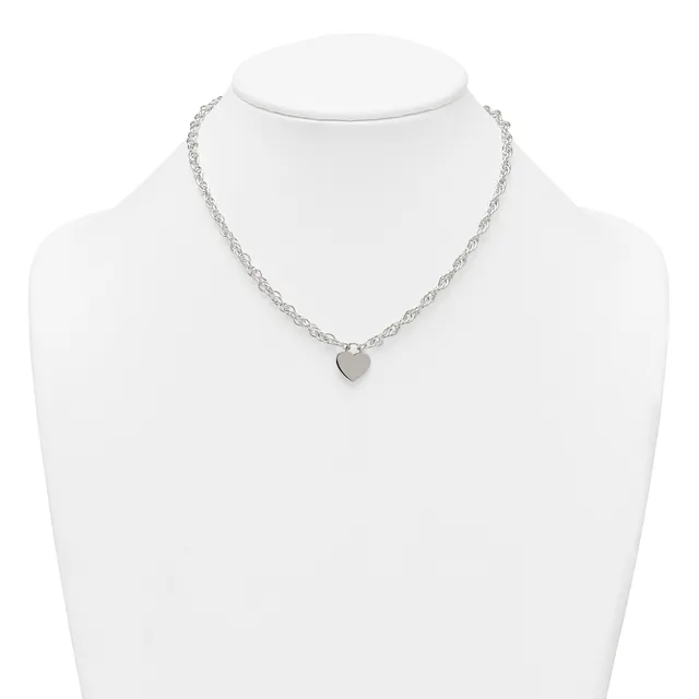 Silver-toned chain necklace with a small heart-shaped pendant, displayed on a white mannequin bust.