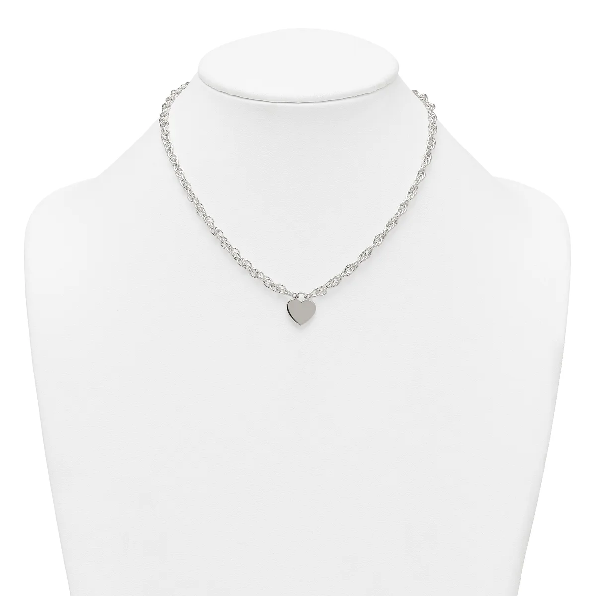 Silver-toned chain necklace with a small heart-shaped pendant, displayed on a white mannequin bust.