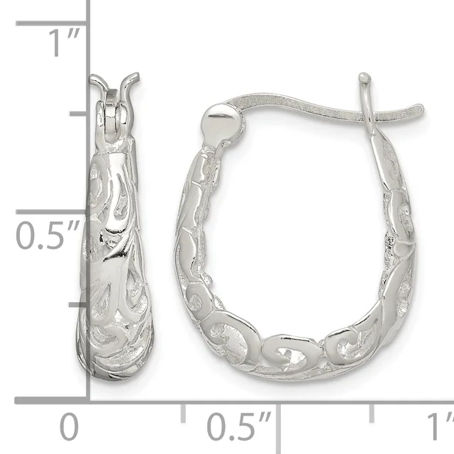 A pair of silver hoop earrings with textured surfaces and decorative patterns, shown with measurement scale indicating approximately one inch in length.