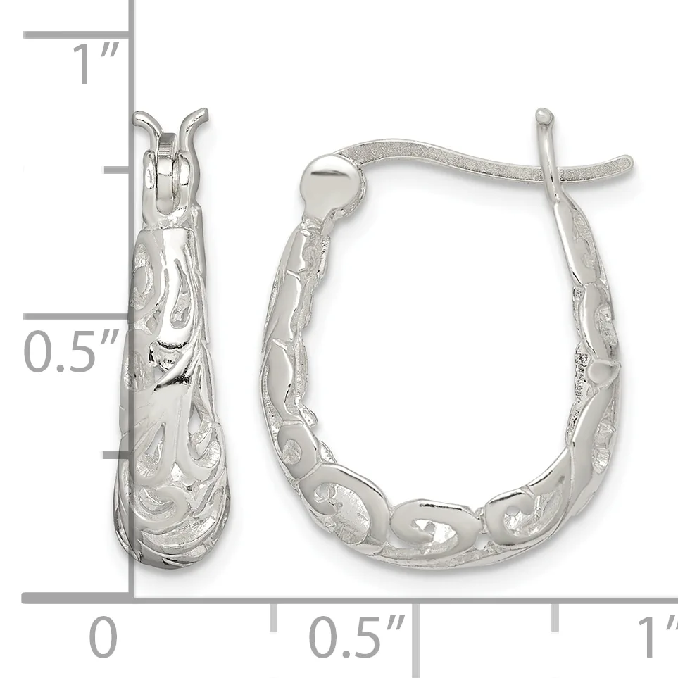 A pair of silver hoop earrings with textured surfaces and decorative patterns, shown with measurement scale indicating approximately one inch in length.