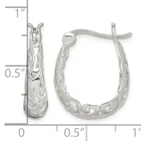 A pair of silver hoop earrings with textured surfaces and decorative patterns, shown with measurement scale indicating approximately one inch in length.