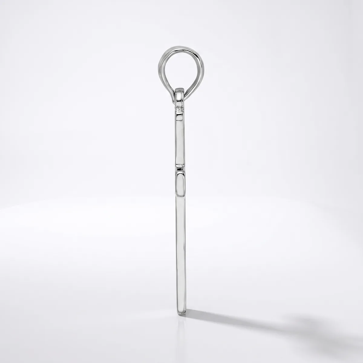 A stainless steel eye bolt with a long shaft and threaded collar, photographed against a white background with a soft shadow.