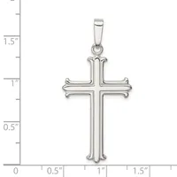 A silver cross pendant with curved ornamental ends on each arm, shown against a measurement scale indicating approximately 1.5 inches in height.