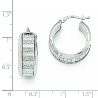 Silver hoop earrings with textured striped surface shown from front and side view next to a measurement scale.
