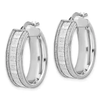 Pair of silver hoop earrings with textured glitter finish and polished smooth sides, shown from front and back angles.