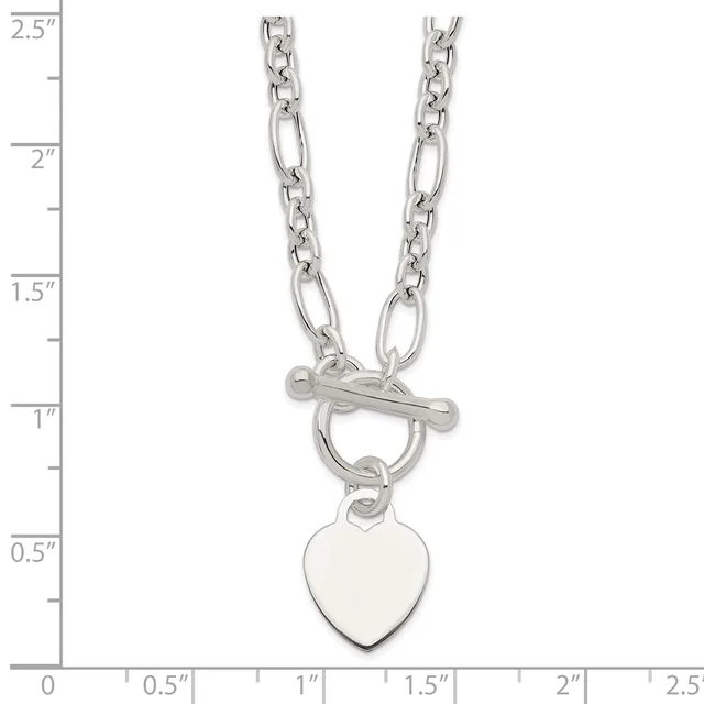 Silver-toned chain necklace with alternating oval and figure-eight links, toggle clasp, and a blank heart-shaped pendant, shown against a measurement scale.