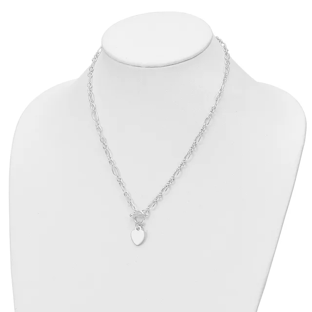 A silver chain necklace with a toggle clasp and a small oval pendant displayed on a white bust form.