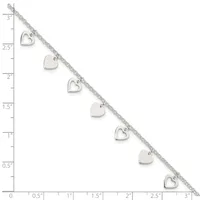 Silver bracelet with alternating solid and open heart charms displayed against a ruler showing 3 inches in length.