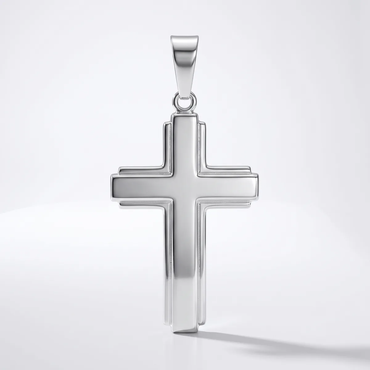 A polished silver cross pendant with a hollow center design and a bail loop at the top, displayed against a white background.