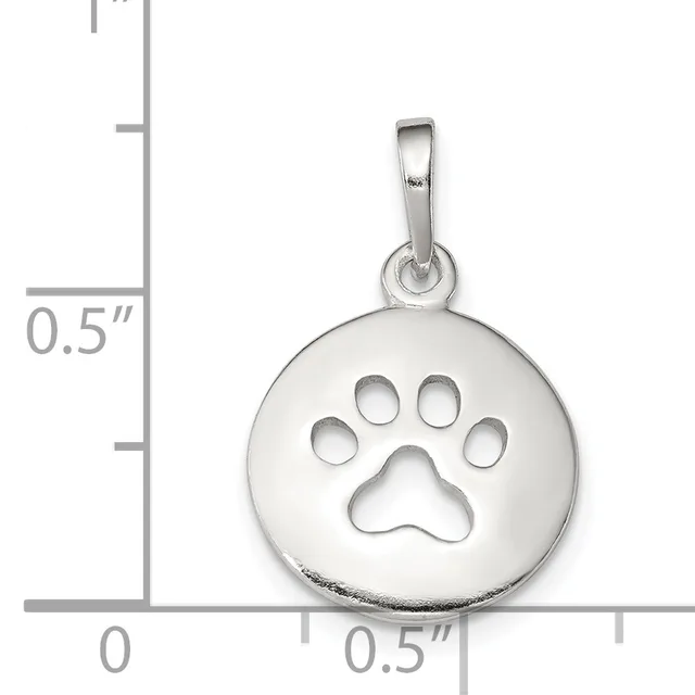 Silver circular pendant with a cutout paw print design, shown next to a measurement scale indicating approximately half an inch in diameter.