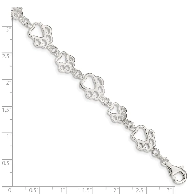 Silver bracelet with repeating paw print and heart charms connected by decorative links, displayed against a measurement ruler showing approximately 3 inches in length.