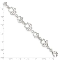 Silver bracelet with repeating paw print and heart charms connected by decorative links, displayed against a measurement ruler showing approximately 3 inches in length.