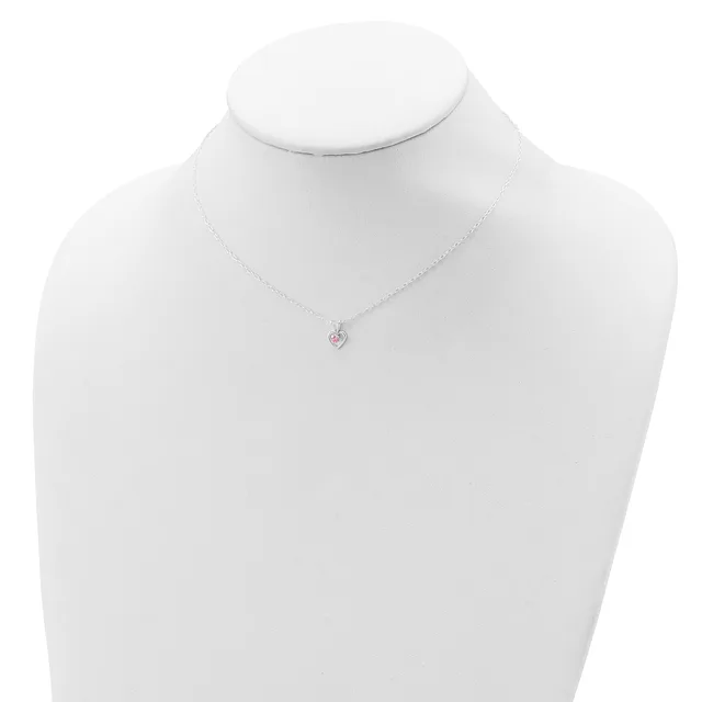 A silver necklace with a small round pendant featuring a pink stone displayed on a white mannequin bust.