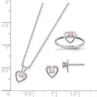 Three sterling silver jewelry pieces with pink cubic zirconia stones arranged on a measurement scale: a heart pendant necklace, matching heart stud earrings, and a heart ring.