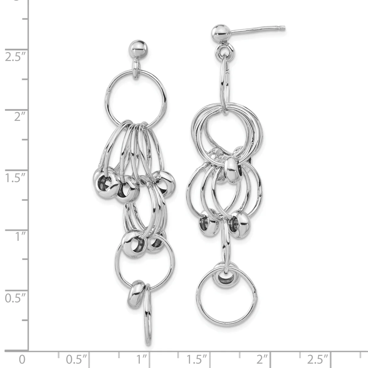 Silver dangle earrings featuring stacked rings and small spheres suspended from ball post studs, displayed on a measurement scale showing approximately 2.75 inches in length.