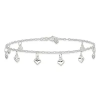 Silver chain bracelet with multiple small heart charms hanging from links, shown laid flat against a white background.
