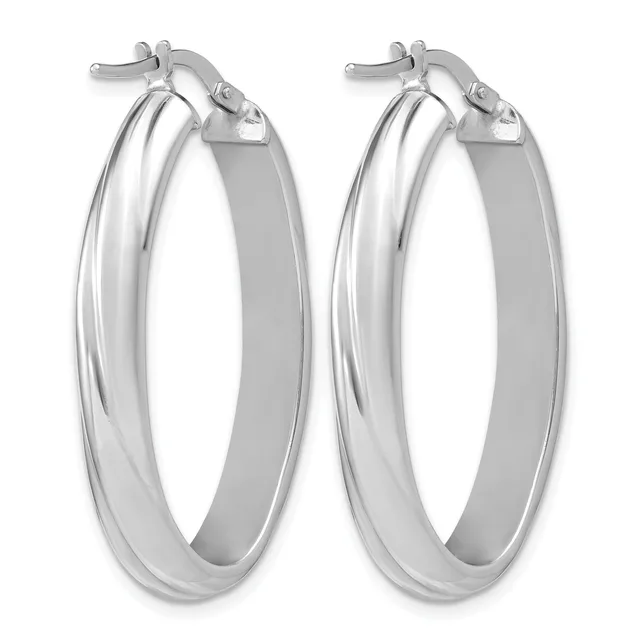 A pair of polished silver-toned hoop earrings with a flat, wide band and hinged post closures, displayed side by side.