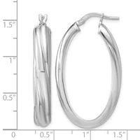 Two polished silver oval hoop earrings with twist texture detail, displayed next to a measurement scale showing approximately 1.5 inches in length.