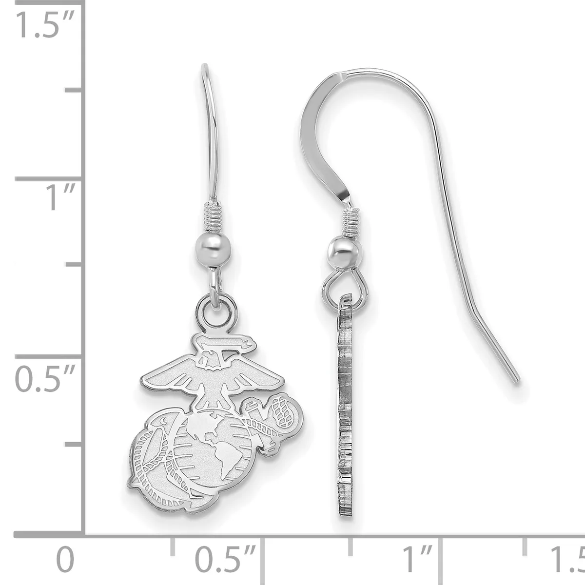 Pair of silver-toned earrings with eagle and globe military insignia charms hanging from fish hook wires, displayed next to a measurement ruler showing approximately one inch in length.