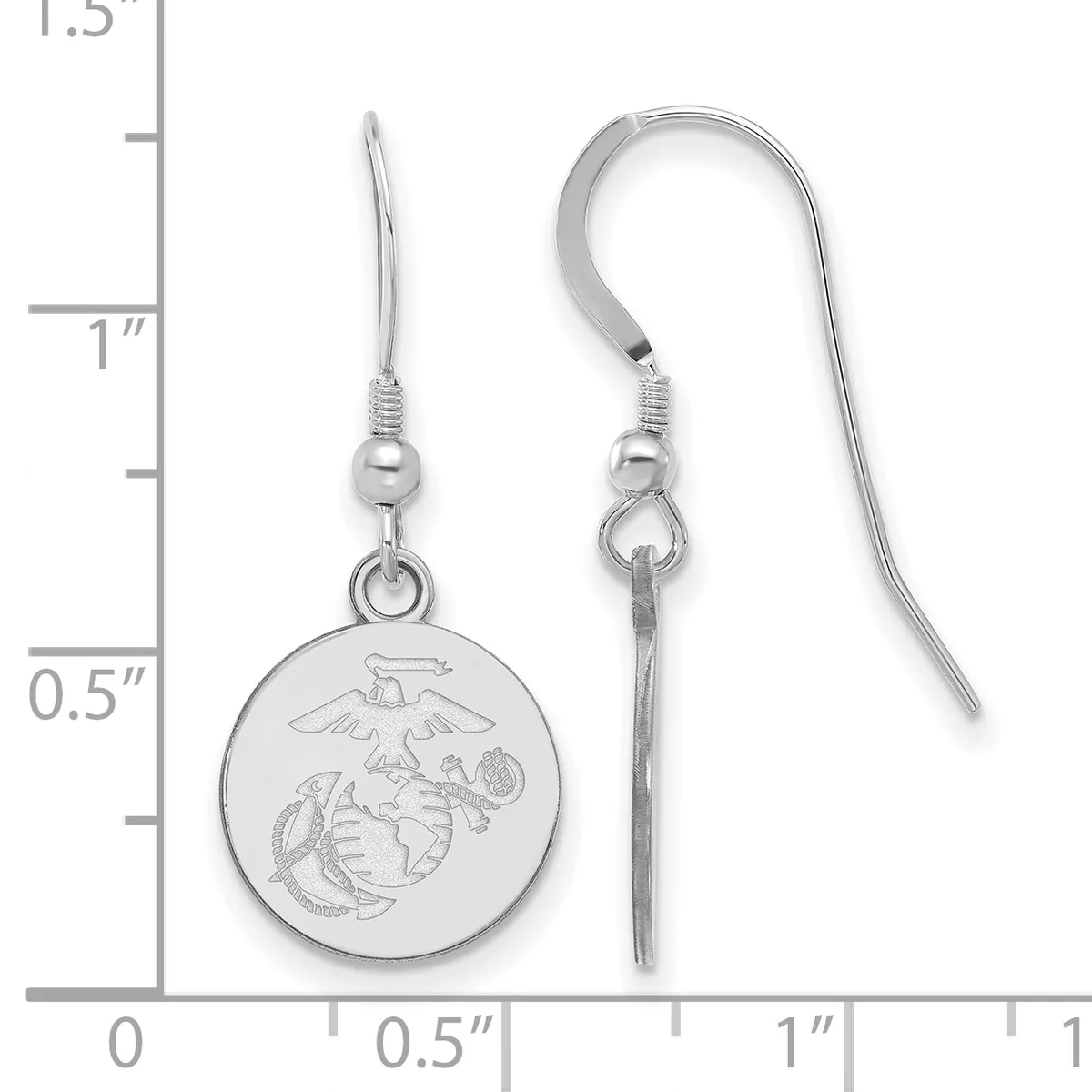 A pair of silver-toned fish hook earrings with circular medal pendants featuring an engraved eagle and shield design, shown next to a ruler measuring approximately 1.5 inches in length.