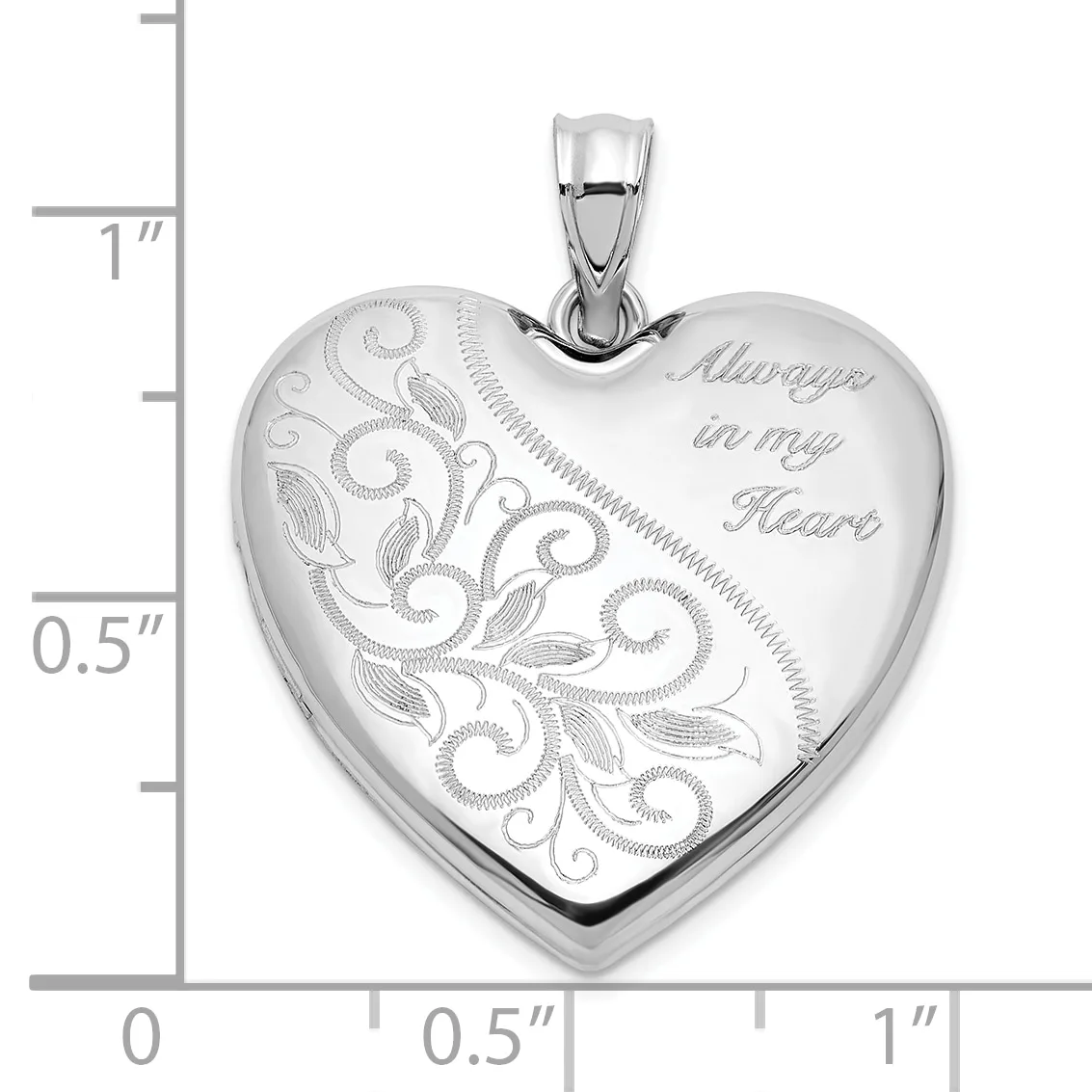 Sterling silver heart locket pendant with ornate scrollwork and leaf engraving on one side and "Always in my Heart" text on the other, shown with scale ruler.