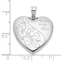 Sterling silver heart locket pendant with ornate scrollwork and leaf engraving on one side and "Always in my Heart" text on the other, shown with scale ruler.