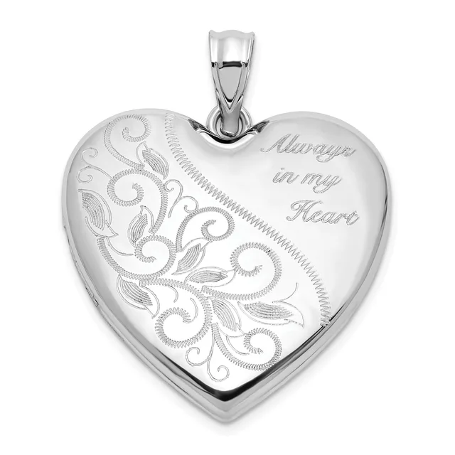 Silver heart-shaped locket pendant with ornamental scrollwork engraving on the left side and "Always in my Heart" engraved on the right, suspended from a silver bail.