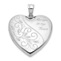 Silver heart-shaped locket pendant with ornamental scrollwork engraving on the left side and "Always in my Heart" engraved on the right, suspended from a silver bail.