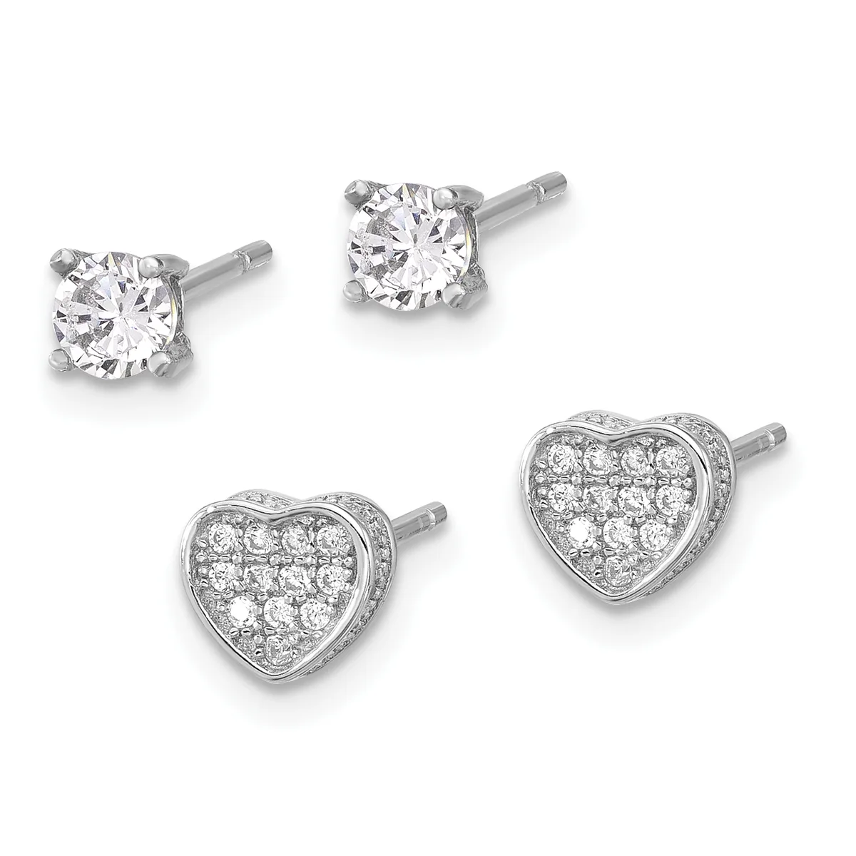Two pairs of diamond stud earrings in white metal: one pair with single round brilliant diamonds, one pair with heart-shaped settings paved with smaller round diamonds.