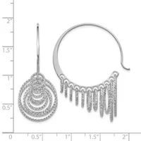 Two silver earrings with cubic zirconia stones displayed against a measurement ruler: a drop earring with concentric circular pendants on a post, and a curved cuff earring with fringe-like dangles along the bottom.