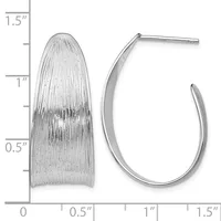 Two silver earrings displayed next to a ruler: a textured oval dome earring and a curved hoop earring, both approximately one inch in length.