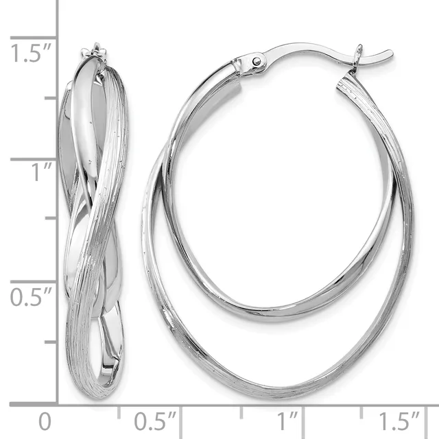 Pair of silver-toned twisted double oval hoop earrings with hinged closures, shown against a measurement scale indicating approximately 1.5 inches in length.