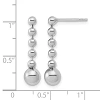 Silver-toned dangle earrings with graduated spheres decreasing in size from bottom to top, displayed next to a measurement ruler showing approximately one inch in length.