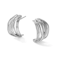 A pair of polished silver curved hoop earrings with multiple parallel ridged bands, shown against a white background.